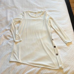 NWOT Ivory dress with side buttons. Asymmetrical style. Never worn.
